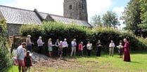 Bishop consecrates churchyard extension