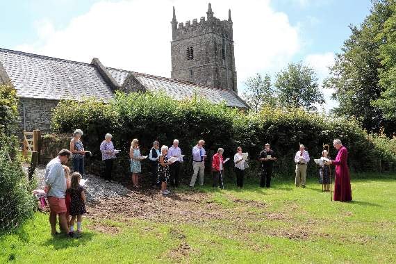 Bishop consecrates churchyard extension