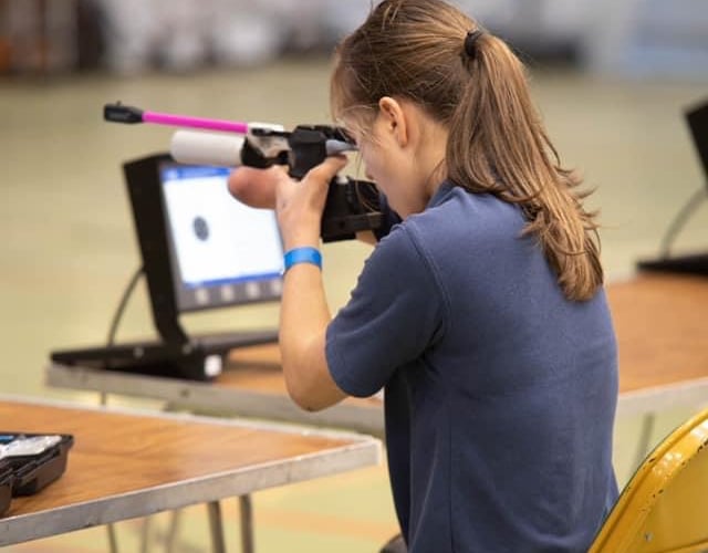 Marina Pritchard competing in rifle shooting at the Schools National Shooting Championships