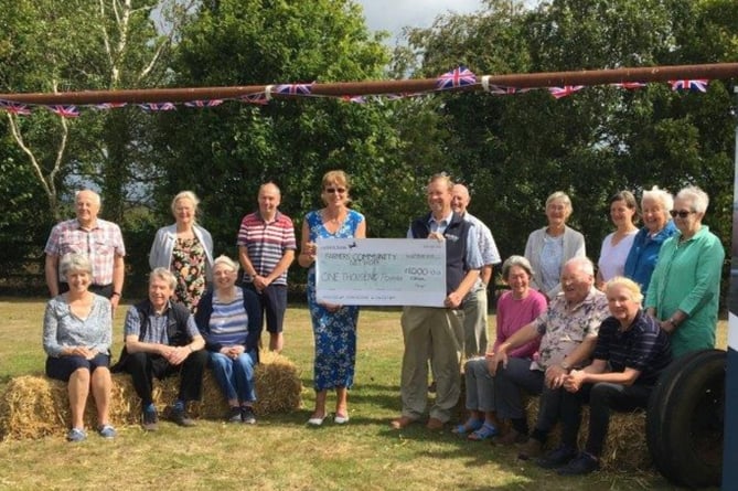 Exbourne Community Choir cheque presentation to Farming Community Network