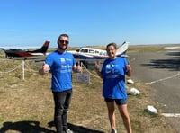 Two daring colleagues skydive for charity