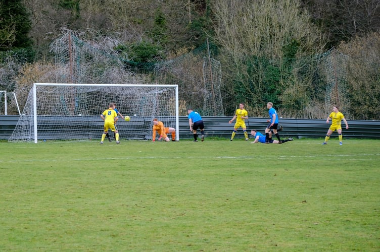 Morgan Reynolds (far right) fires home Okey's first goal.jpg