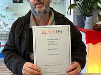 Brian earns certificate for next stage of Read Easy course