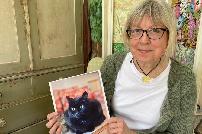 Karen Burgess and Harry the cat.