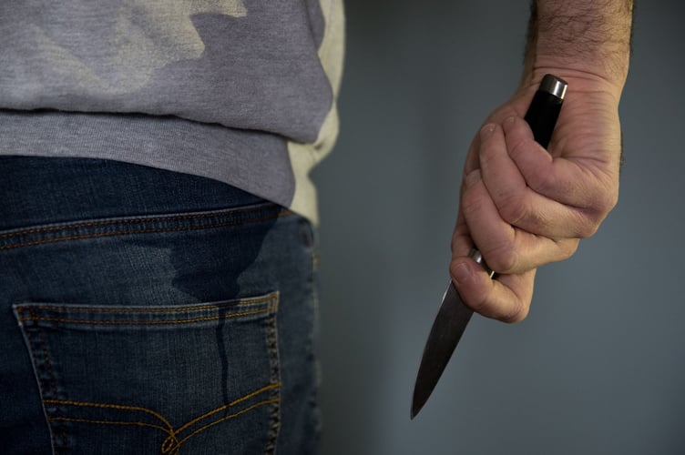 A model poses holding a knife. PA Photo. Picture date: Thursday January 16, 2020. Photo credit should read: Andrew Matthews/PA Wire