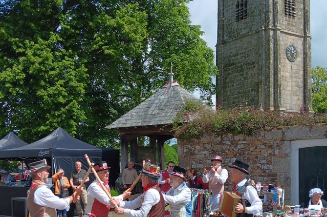 Tinners Morris dancing outside St Andrew's Church in Sampford Courtenay