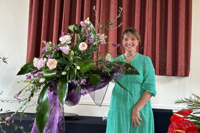 Floral demonstrator Alison Penno created a special arrangement to mark the 40th birthday of Sampford Courtenay Flower Club – with references back to 1984