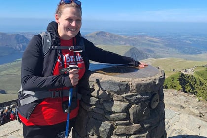 Teacher conquers mountain in friend's memory