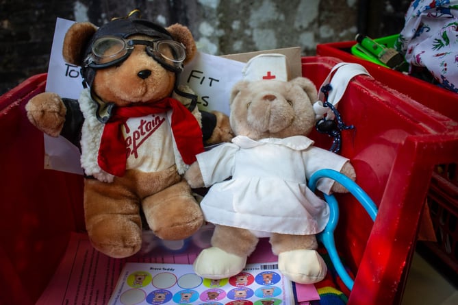 Brave teddies prepare to abseil at All Saints' Church, Okehampton