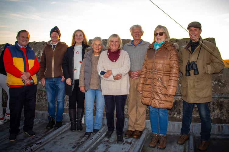 These good souls saw the sun rising from the top of All Saints' Church in Okehampton at the start of their successful open day, which saw people in the community find out more about what goes on at the parish church. There was even an abseil for teddies, much to the delight of their young owners. Full story, page 25. Picture by Clare Barton