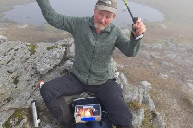 John bagging his 282nd Munro - the final one