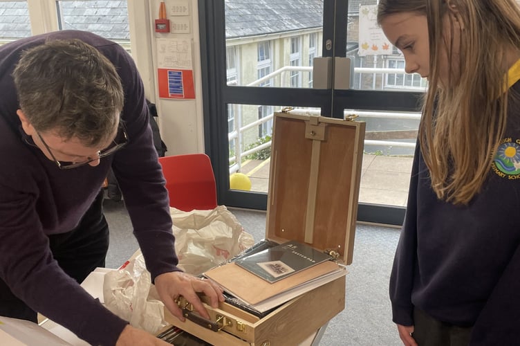 Mel Stride MP presenting Christmas card winner, Chloe Rice, with her prize.